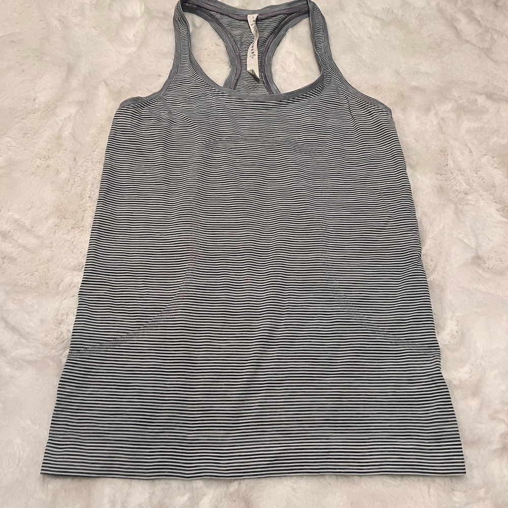 Lululemon tank. Women’s size 6. Color is a grey and black stripe.